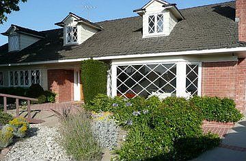 view from driveway showing dry creek bed