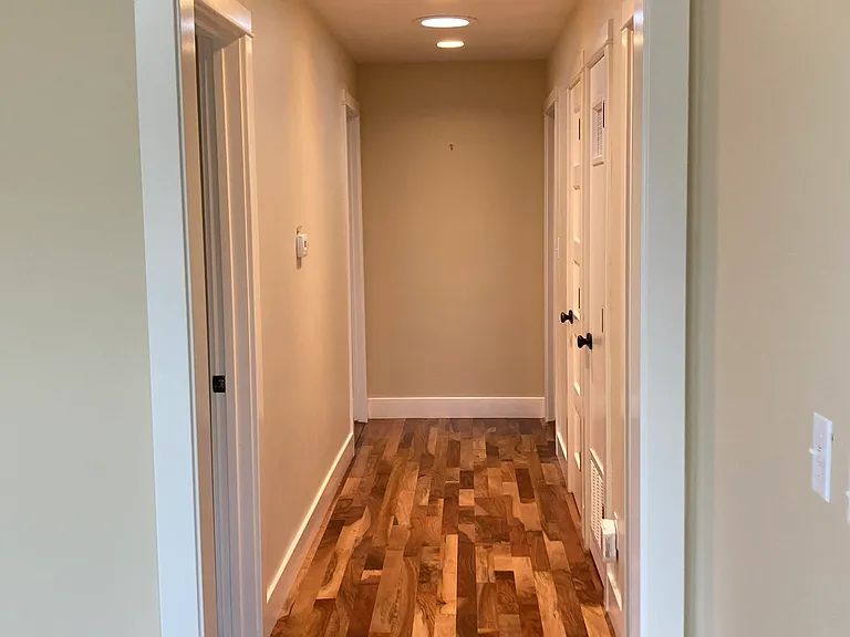 Hallway to 3 bedrooms and 2 bathrooms
(2 bedrooms on left, 1 on right)