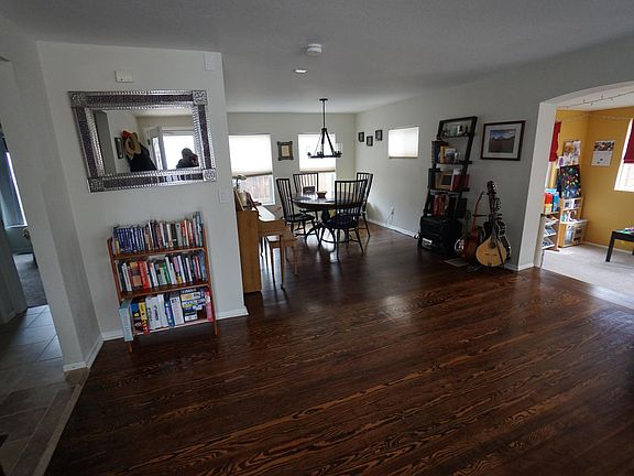 From the front door; bonus space visible on the right has been freshly painted in neutral tones.