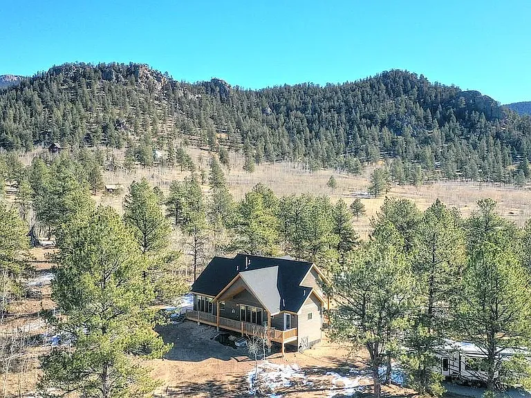 private lot nestled up to the national forest