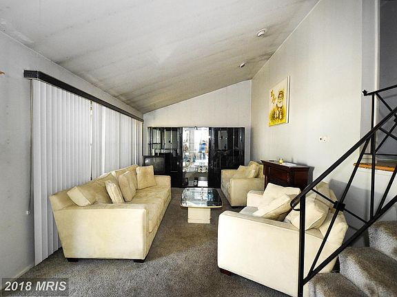 Living Room and Stairs leading to the Upper Level