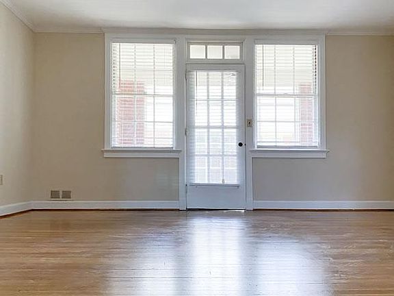 Living room opens onto screened porch