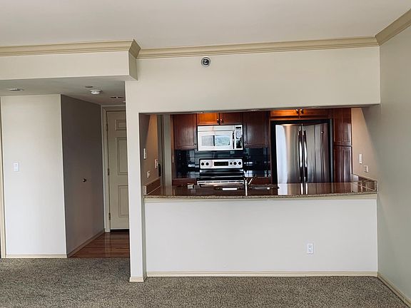 Kitchen view/ stainless appliances and granite counter