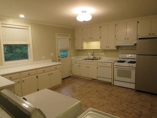 Large kitchen with ample storage, all appliances included and plenty of room for a center island or high top table