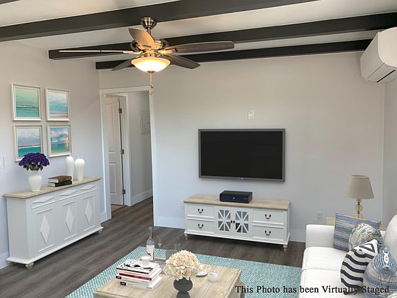 Living room, A/C and hallway to the bedrooms