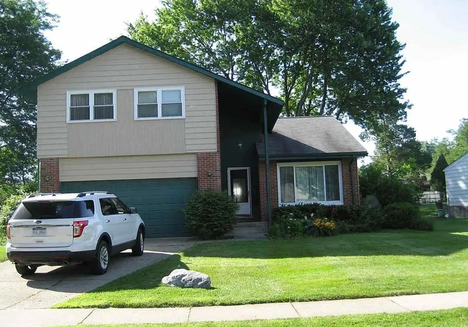 Spacious & Updated Novi Colonial | Vaulted Ceilings, Fireplace & Private Deck — Photo 1