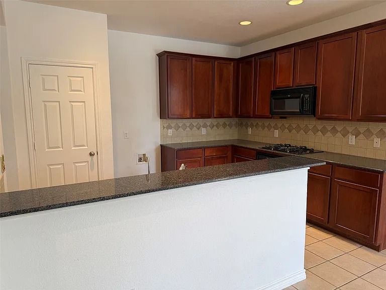 Kitchen with breakfast bar.
