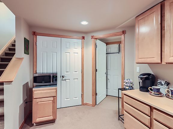 Private lower level kitchenette with microwave, mini-fridge and coffee maker.