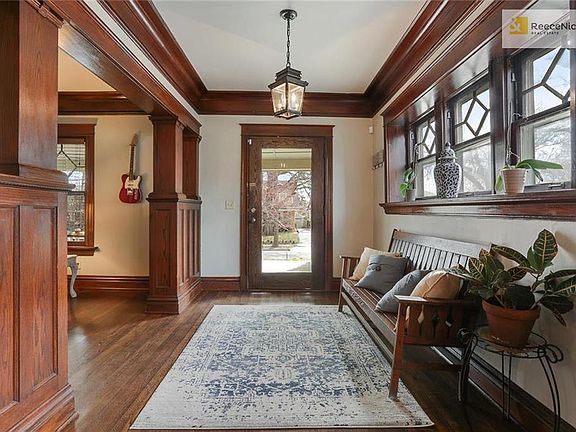 Wonderful entryway with original windows and room to put on your shoes