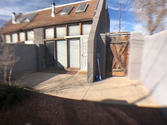 Back yard gate. Security door into apartment.