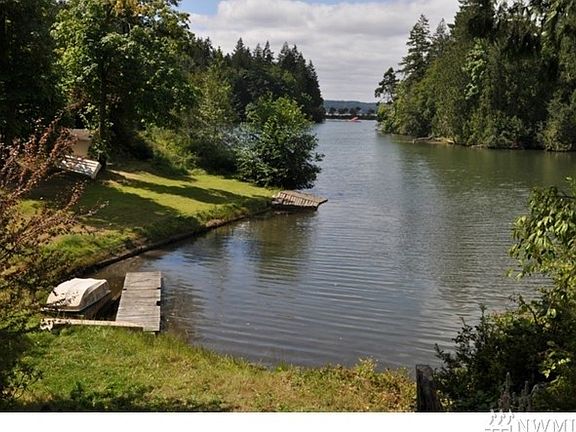 View off deck of Cove, private beach on the Sound in the distance. You can either walk or drive to the beach area. There are some very good Blackberries that grow along the private beach area too!