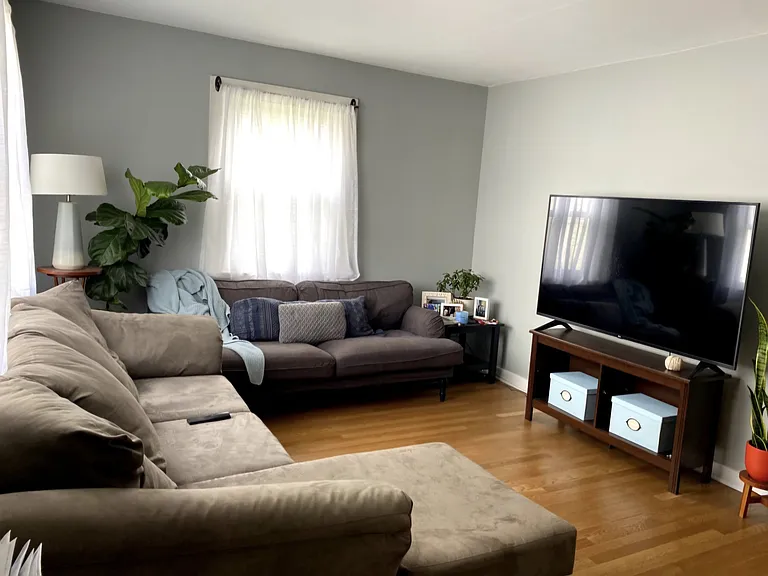 Living room has hardware flooring.