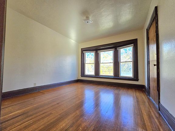 Bright den area off the living and dining room, offering a versatile space for work, relaxation, or hobbies