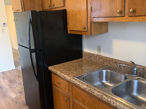 Black kitchen appliances include:
refrigerator, range, dishwasher