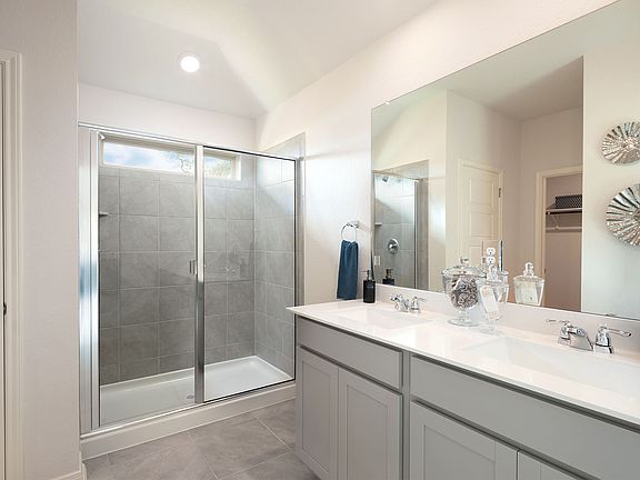 The luxurious primary suite boasts a huge walk-in closet.