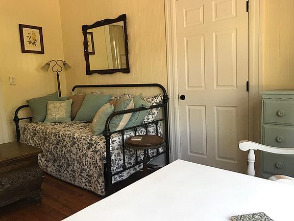 Farmhouse dining table and day bed doubles as sofa