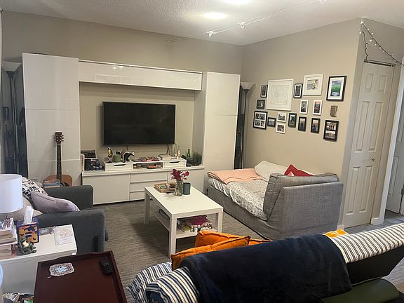living room with current tenants decor and moved furniture