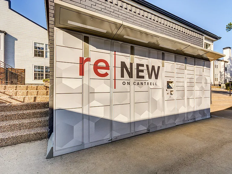 Branded package lockers outside the leasing office are shown at ReNew on Cantrell.