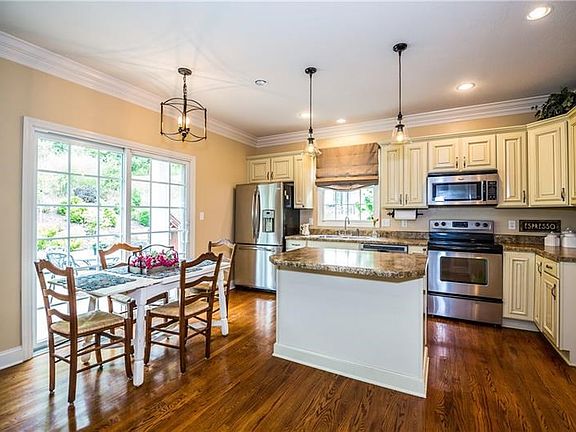 Enjoy looking out onto your perfectly landscaped backyard from your spacious 15x15 kitchen. Refrigerator, stove and microwave ar