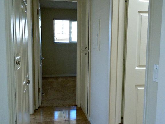 Hallway, bathroom on right, master bedroom on the left and s