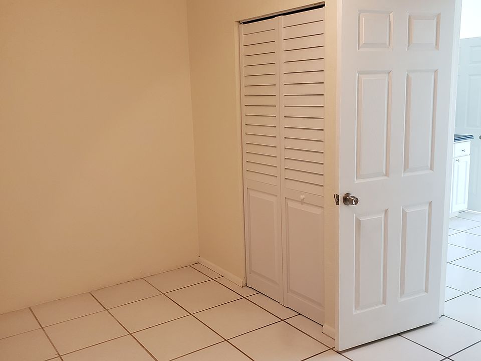 Bedroom with fan and closet