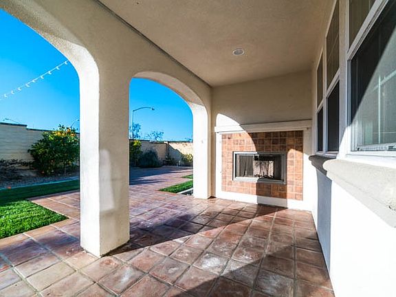 Patio with fireplace