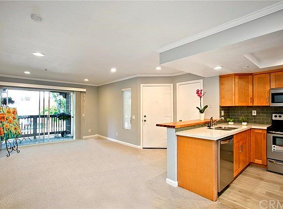 Open floor plan to looking out to the patio and lush green belt!