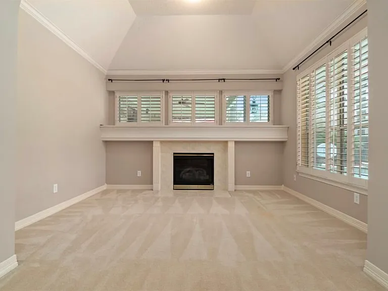 Master bedroom has its own living room area. Gas fireplace and pool view.
