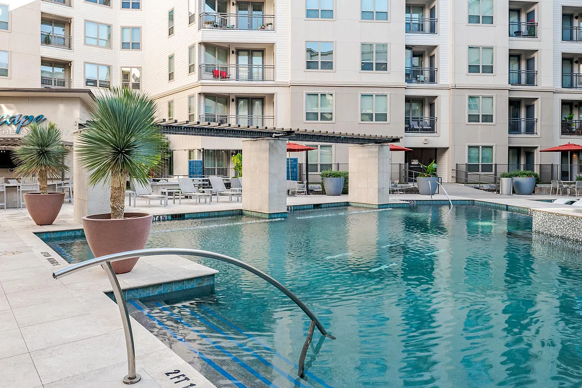 Contemporary Poolside Courtyard with Palms and Shaded Loungers - Domain at The Gate