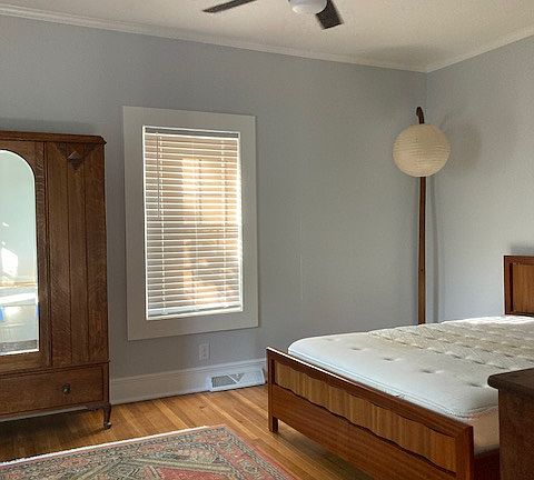 Main bedroom, freshly painted walls and refinished hardwood floors