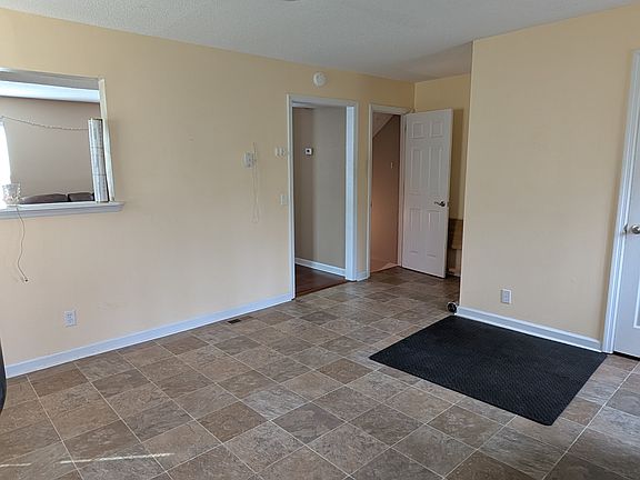 view of kitchen facing stairs to lower level (picture from side A)