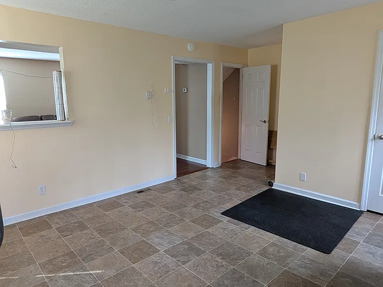 view of kitchen facing stairs to lower level (picture from side A)