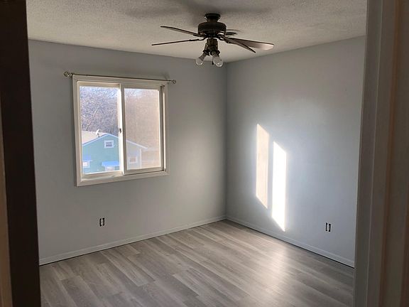 13x13 Second Bedroom with closet and ceiling fan.
