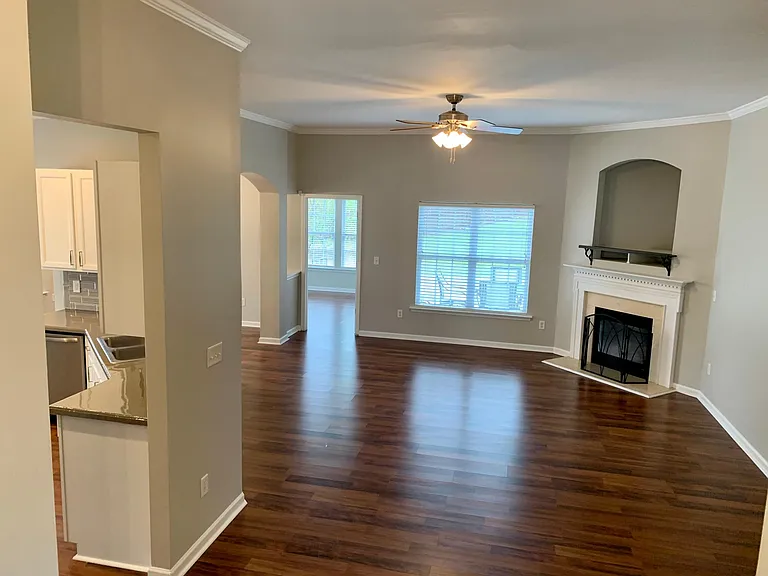 View of expansive living room with gas fireplace and loads of natural light.....
