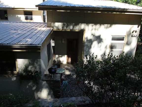 Closer shot of front entry and sitting area