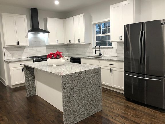 Spacious, contemporary kitchen with all new black stainless steel appliances