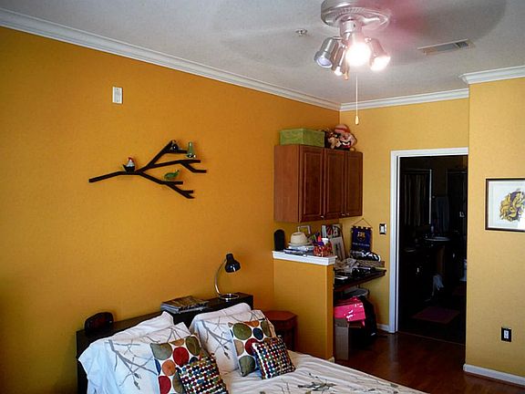 Spacious bedroom with built-in desk and cabinets. Upgraded wood floors in both bedrooms.