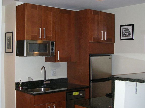 Wood Cabinets, Granite Countertop, Breakfast Bar, Stainless Steel Appliances