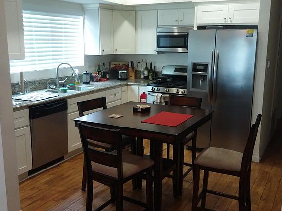 Shot of the kitchen, Stainless Stove, Dishwasher Fridge and Microwave