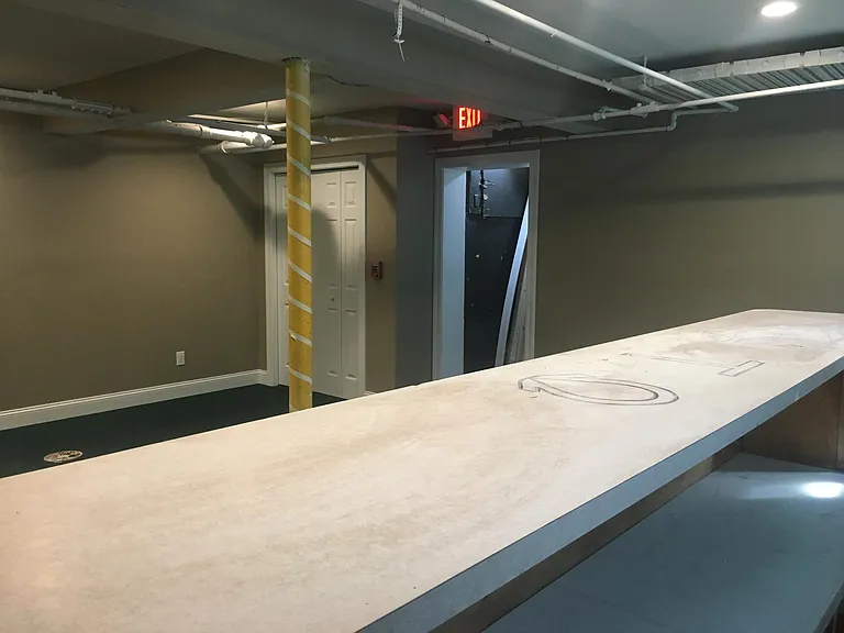 Social space, toward the basement egress stairway