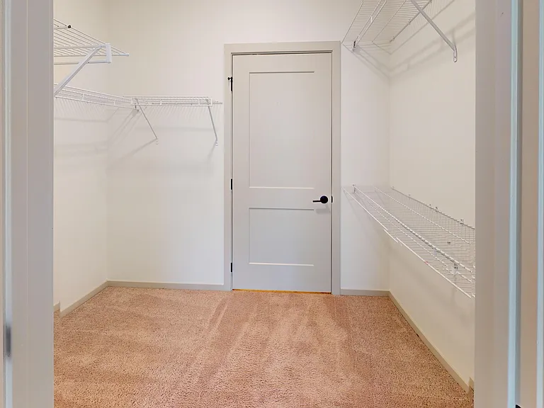 The Henry layout features a spacious walk-in closet that leads to the bathroom. The Henry layout features a spacious walk-in closet that leads to the bathroom.