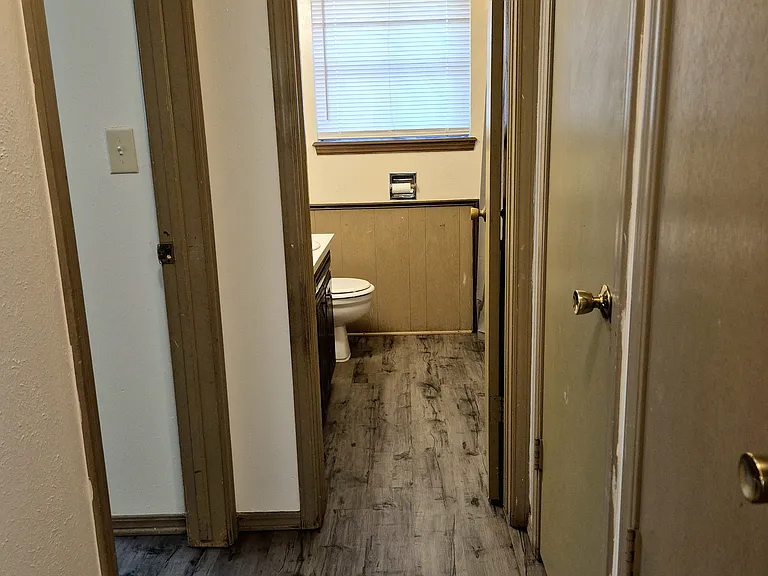 Hallway leading to main bath