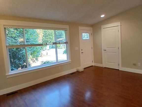 Formal Living Room with beautiful floors and coat closet.
