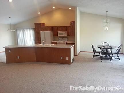 Kitchen, eat in and diningroom
						:
						Open concept. Looking from greatroom into kitchen area.