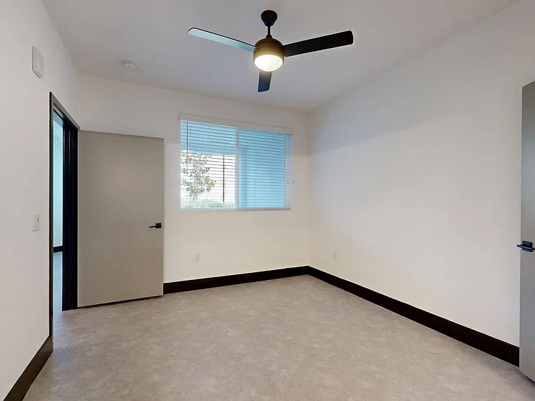 Spacious apartment with tile floor.