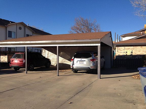 Carport with locking storage for each unit.