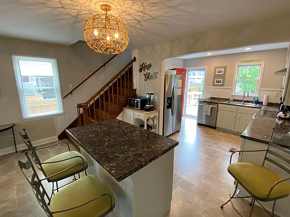 Bright kitchen, open concept to living room and dining room