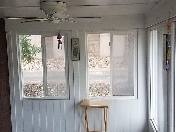 Enclosed 3 season front porch with ceiling fan