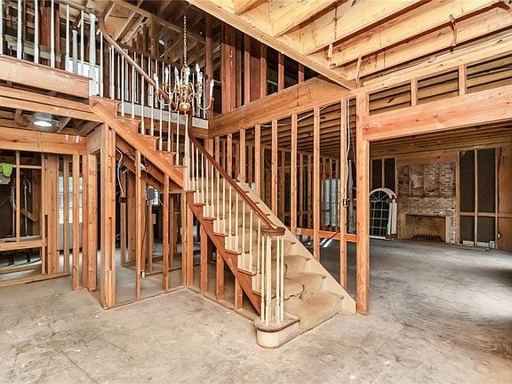 Foyer and staircase to the 2nd floor with formal living room/ office to the right