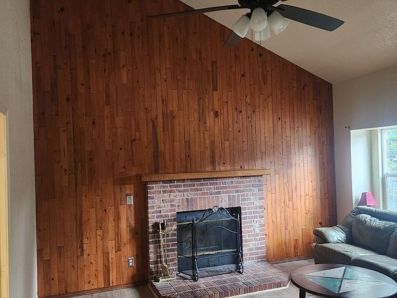 Living room w/ wood fireplace